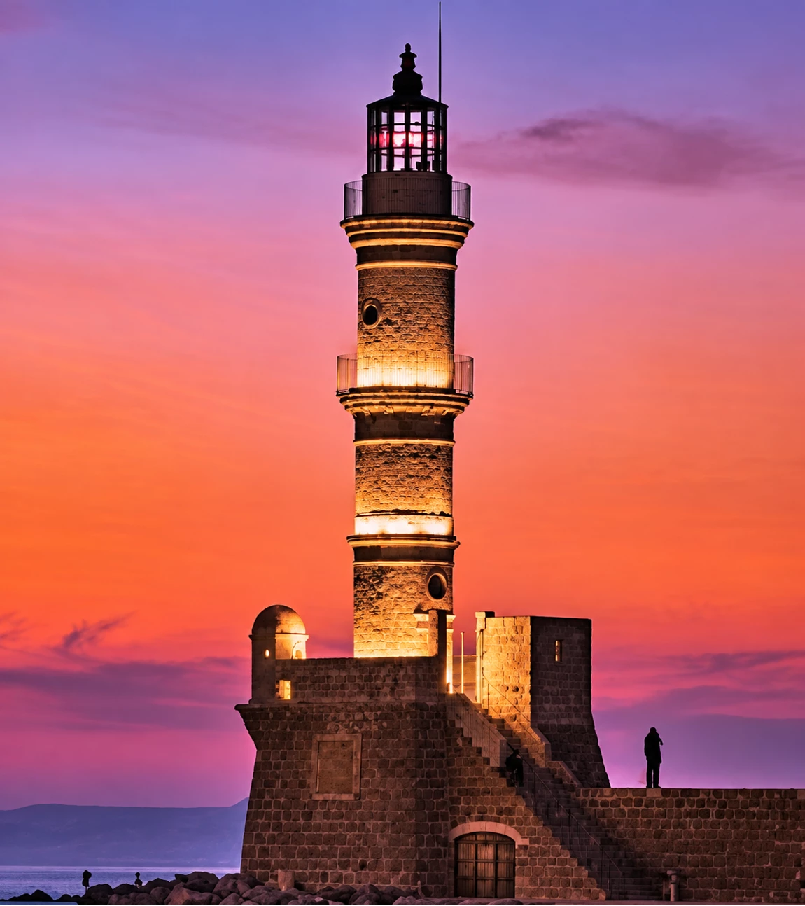 Lighthouse at sunset on the Mediterranean coast